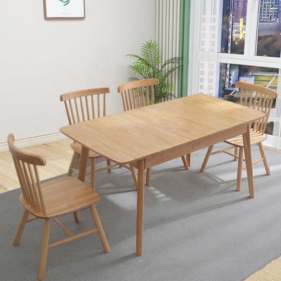 Table à manger en bois massif nordique et combinaison de chaises pour une salle à manger simple, moderne et écologique