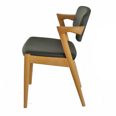 Chaise de salle à manger en cuir en PU en bois pour café d'hôtel polyvalente et fonctionnelle