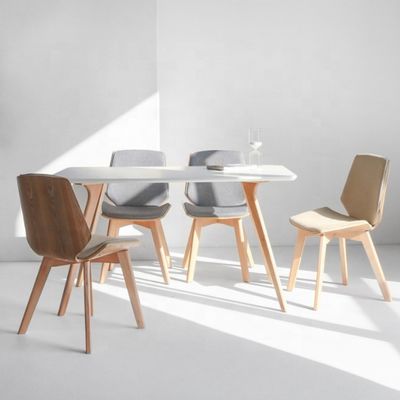 Économie commerciale Chaise à manger en tissu avec des jambes en bois massif et un design en tissu moderne