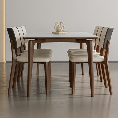 Table à manger en bois massif de design nordique moderne avec chaises en cuir en PU noir/blanc et style nordique